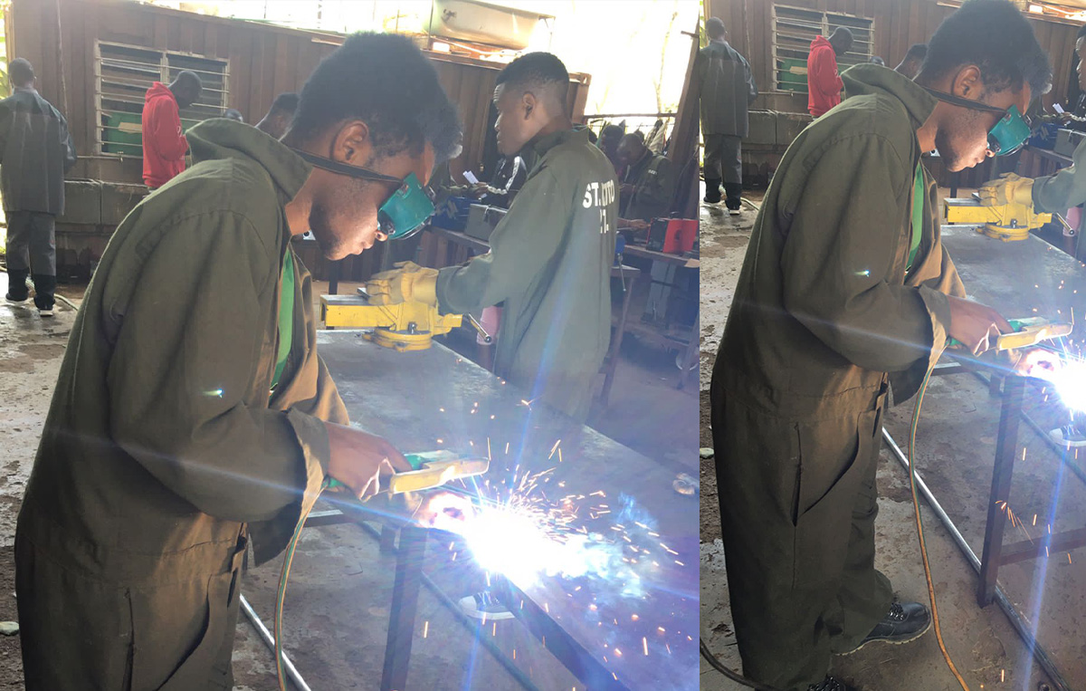 Kelvin doing welding at St. Kizito