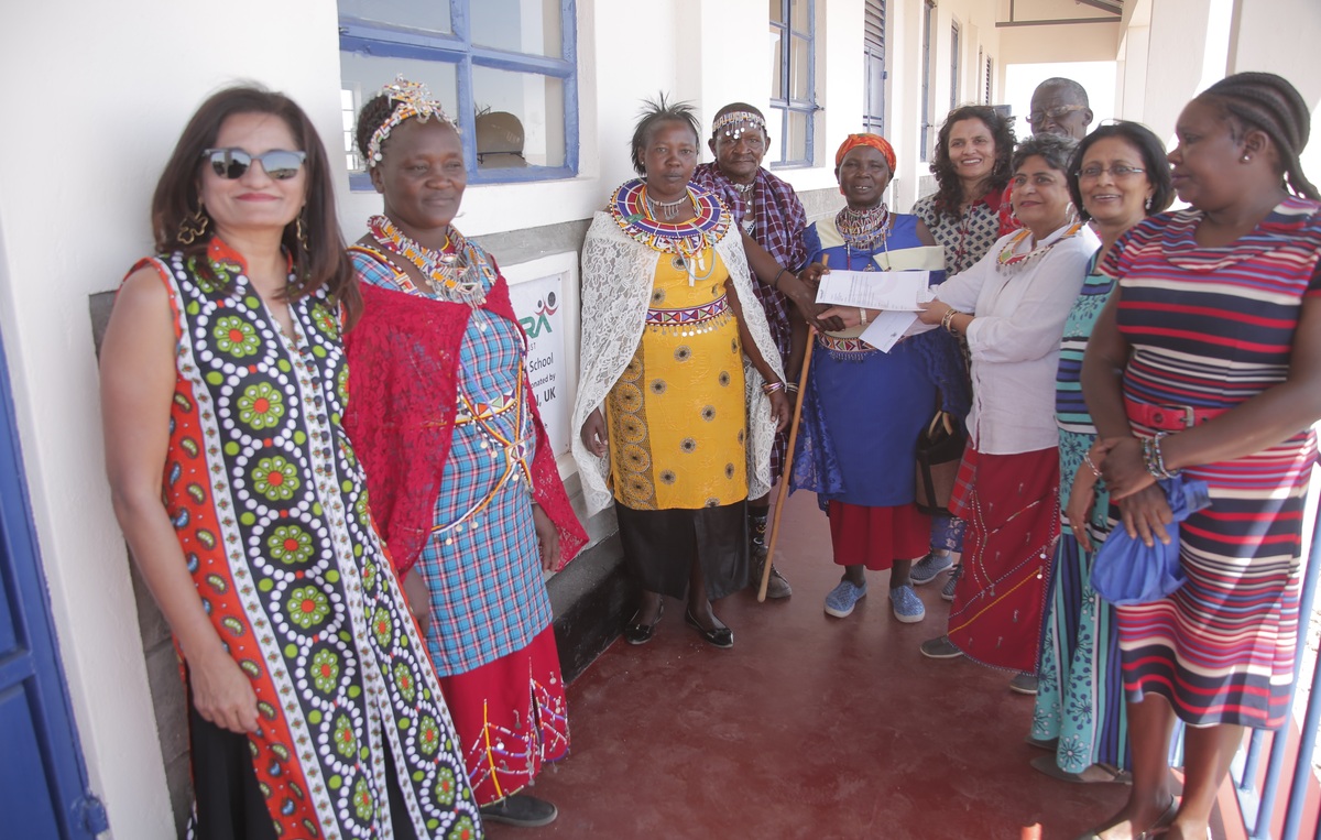 Presenting Handover documents for the Girls’ dormitory at Empakasi Secondary School