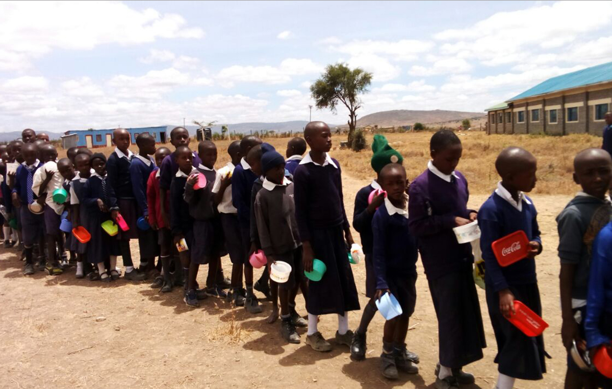 Students of Kwa Mboo Primary Sch- in a queue