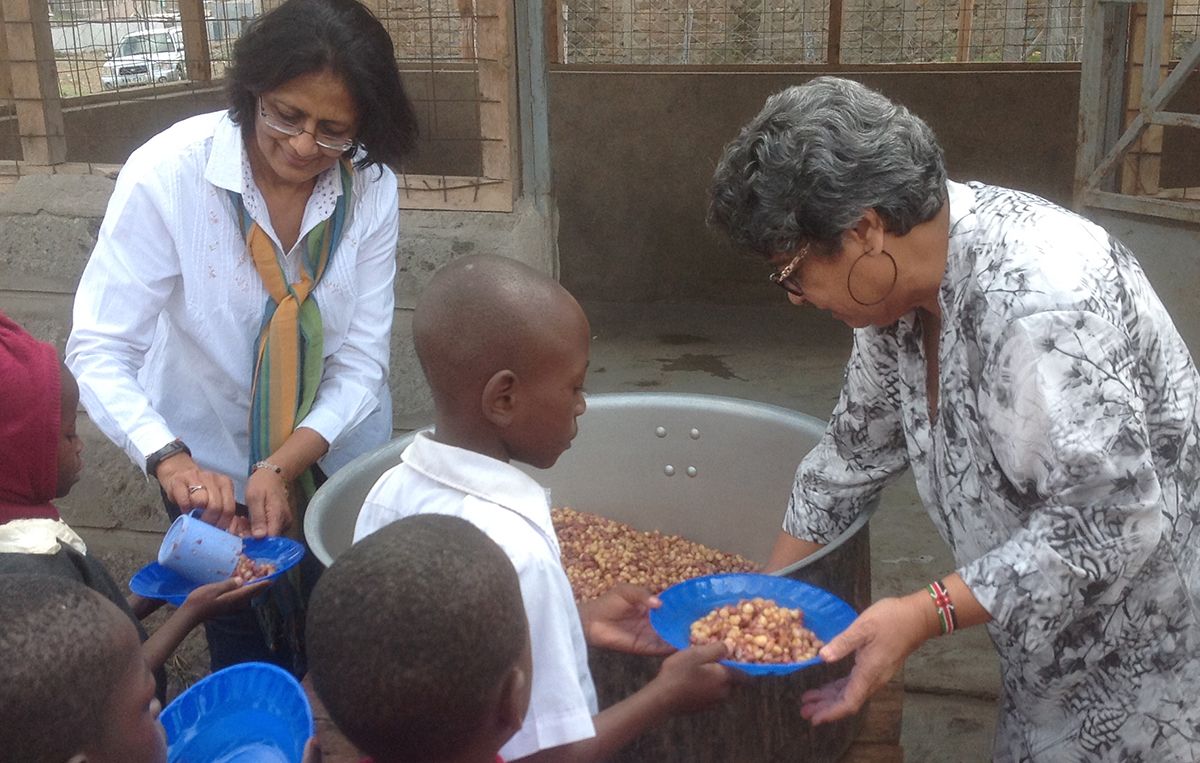 Trustees serving lunch to kindergarten children at Ngwata Primary School