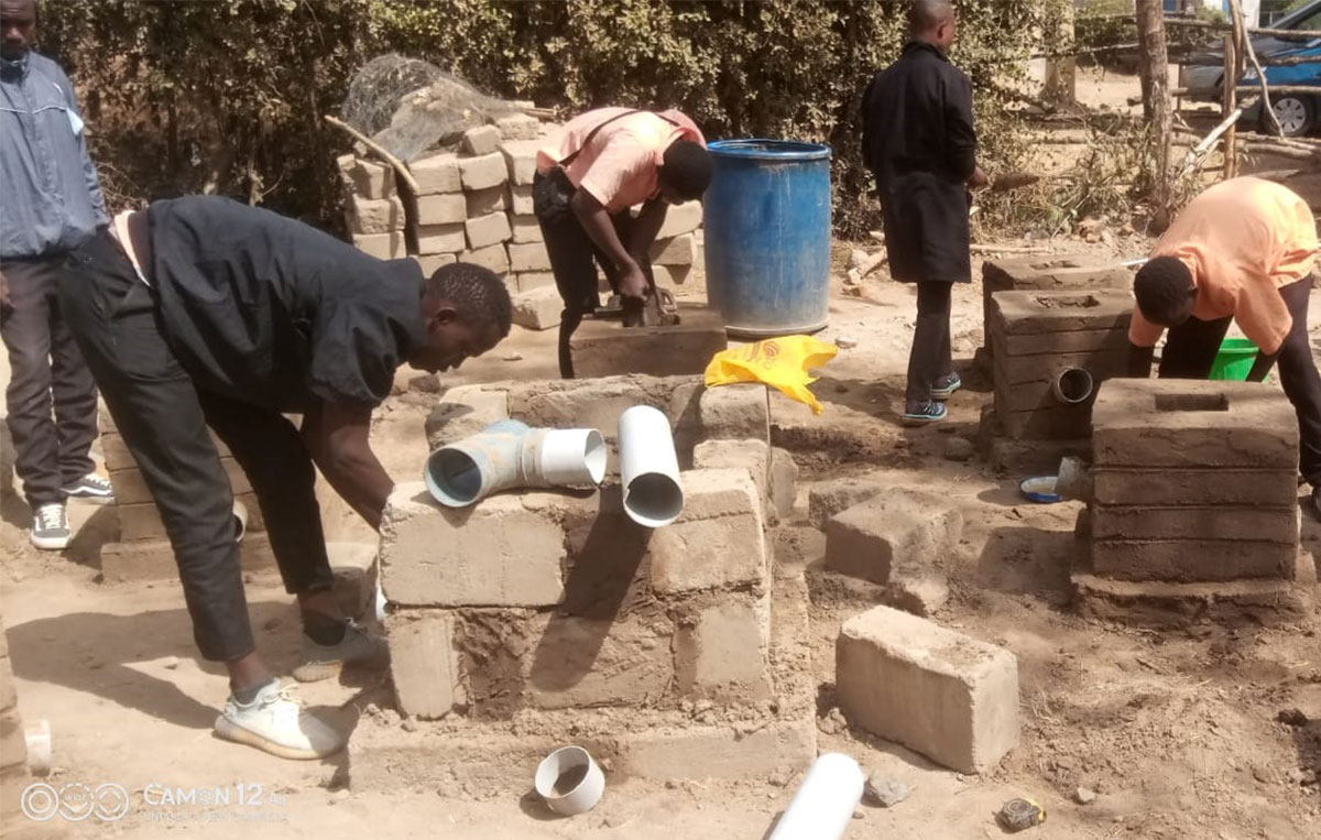 Masonry students at Mitaboni Technical Institute learning how to lay bricks