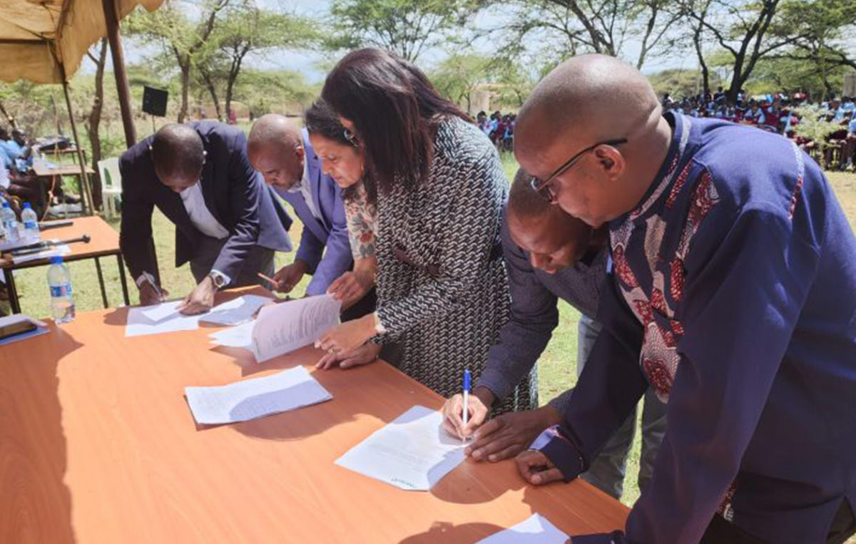 Signing of official handover documents for the new Boys’ dormitory at Najile Boys Secondary School